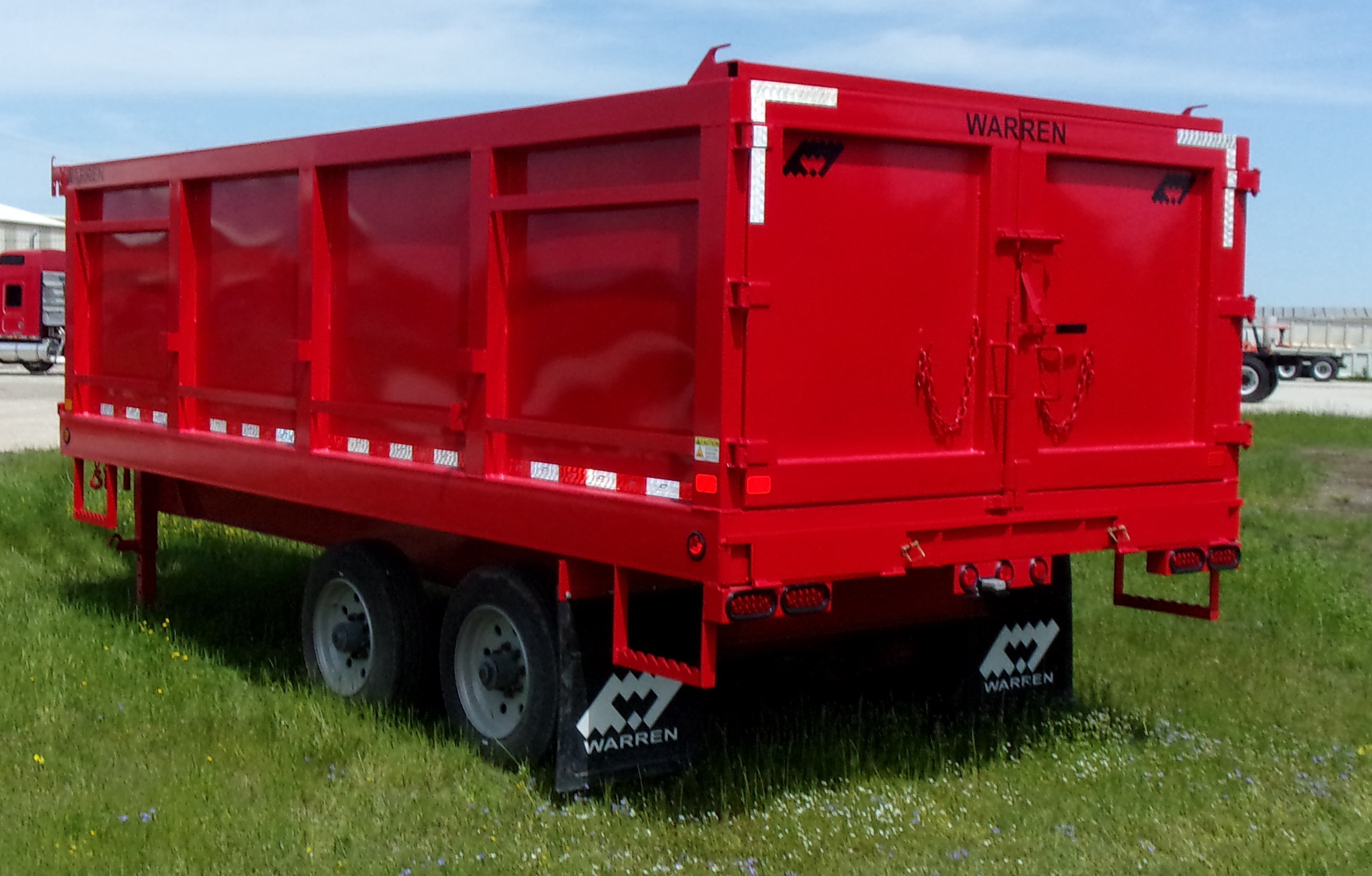 Red gooseneck dump trailer