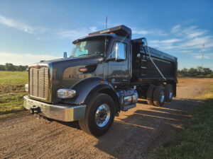 Peterbilt semi-truck equipped with professional half round dump body