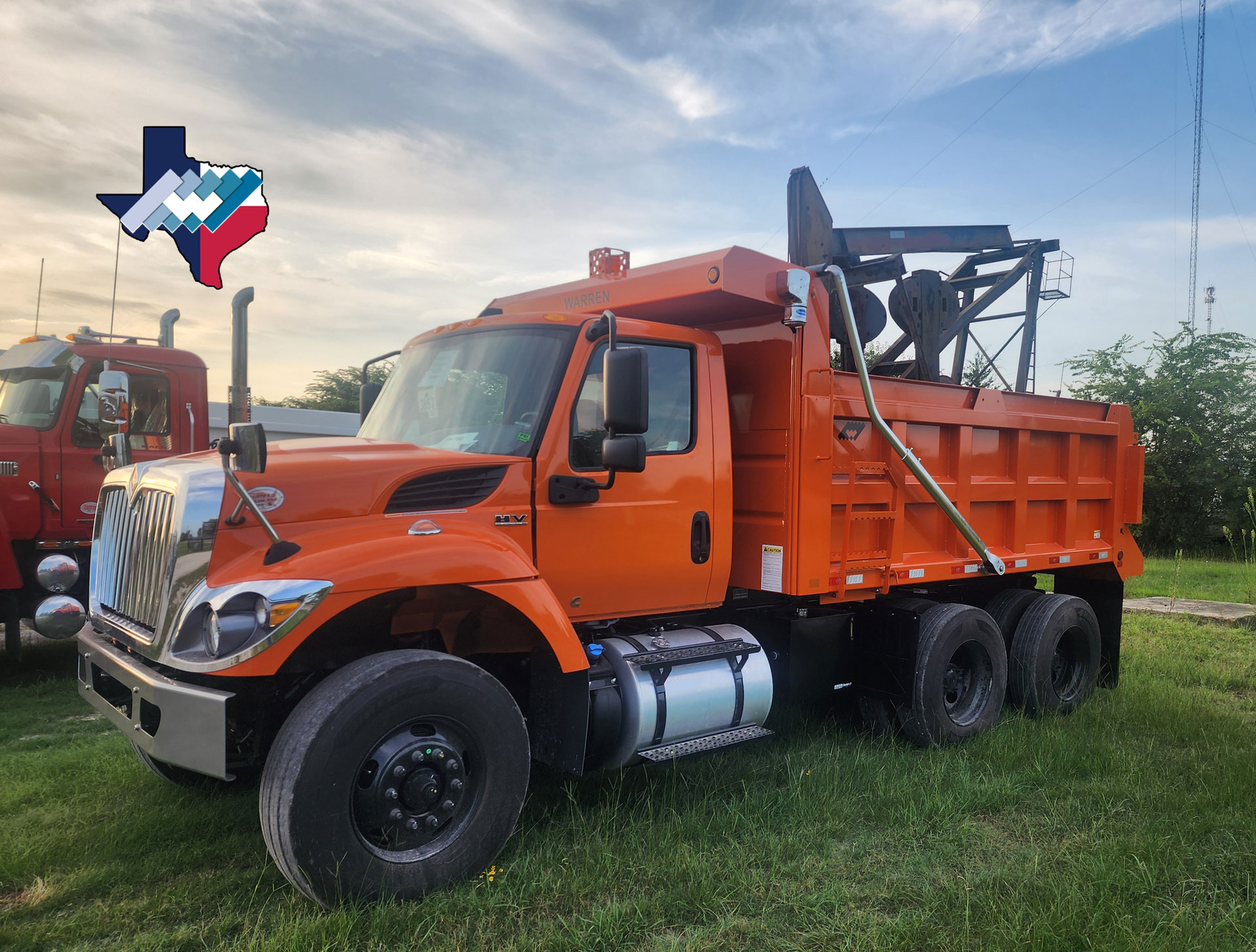 Vibrant Longhorn Orange Warren Frameless 13-foot dump body on worksite