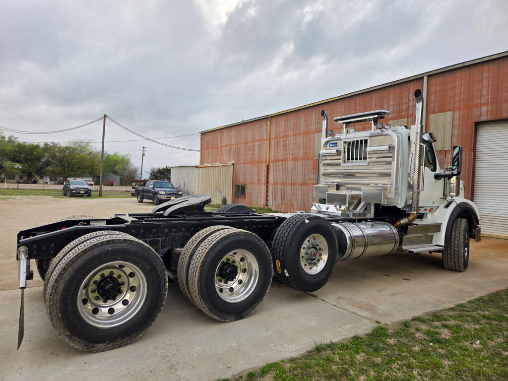 International truck configured for low boy haul trailer with aluminum cab rack and connection box